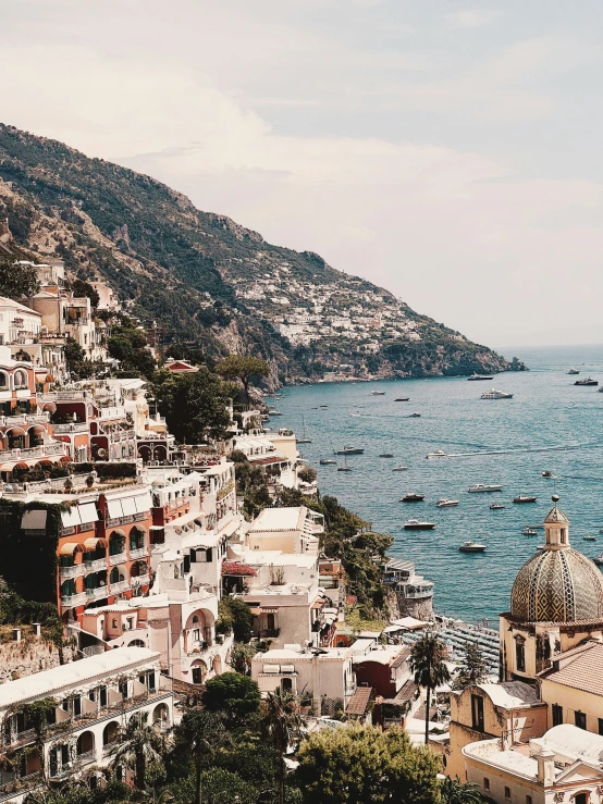 a view of a coastline with buildings overlooking it