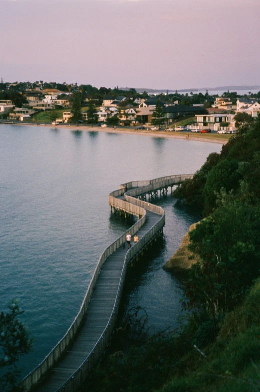 a wooden bridge spanning across a large body of water