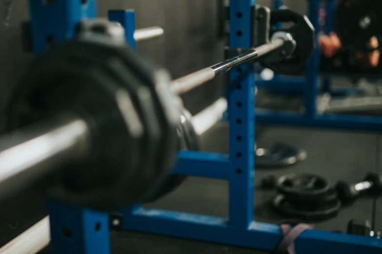 close up of a weight machine with bar