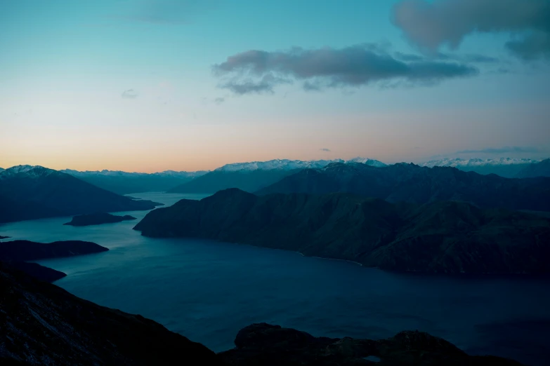 an aerial po of some mountains and some water