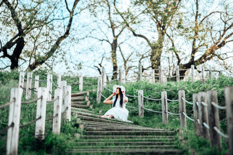 a bride and groom posing on wooden steps