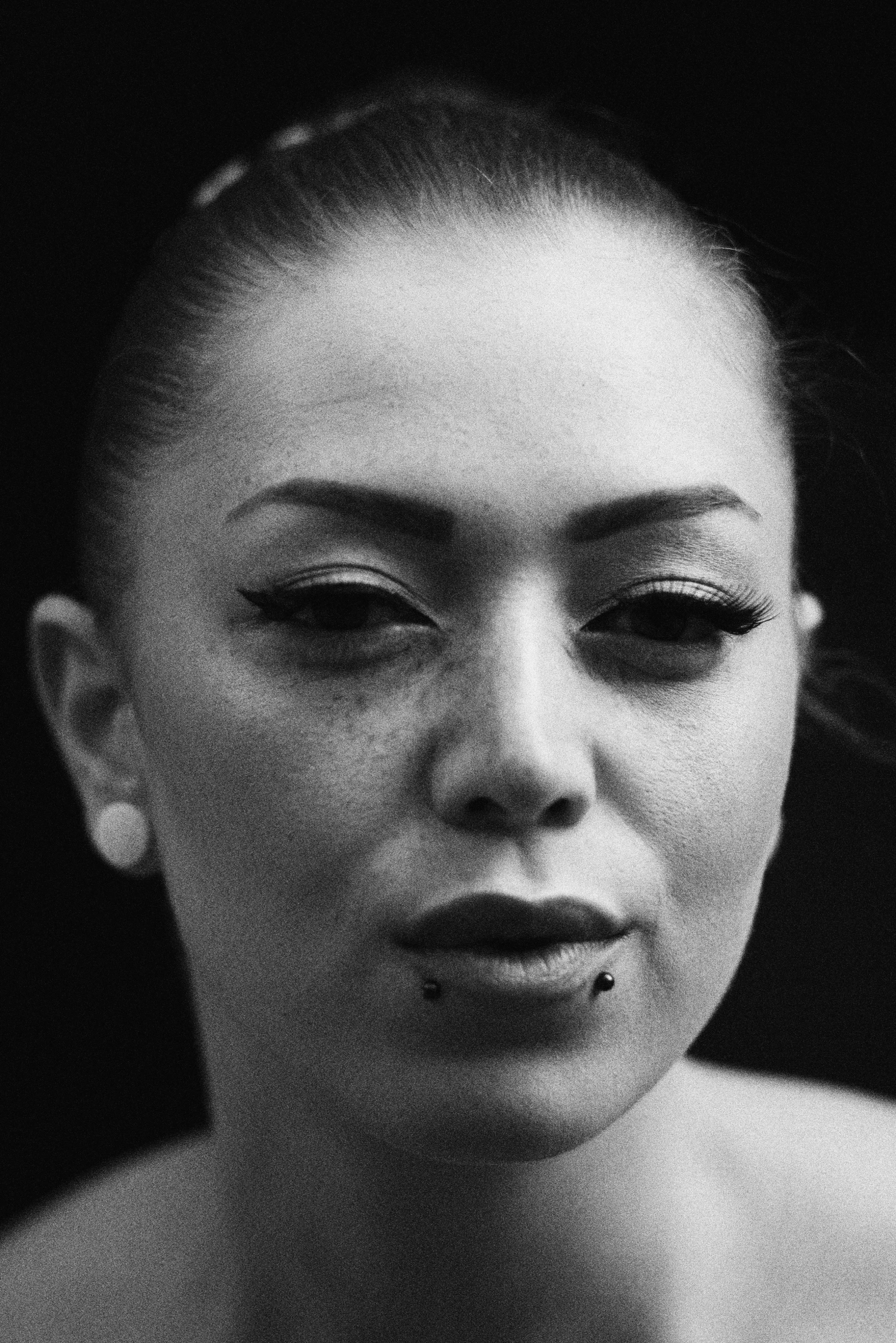 black and white pograph of a woman with a cigarette in her mouth