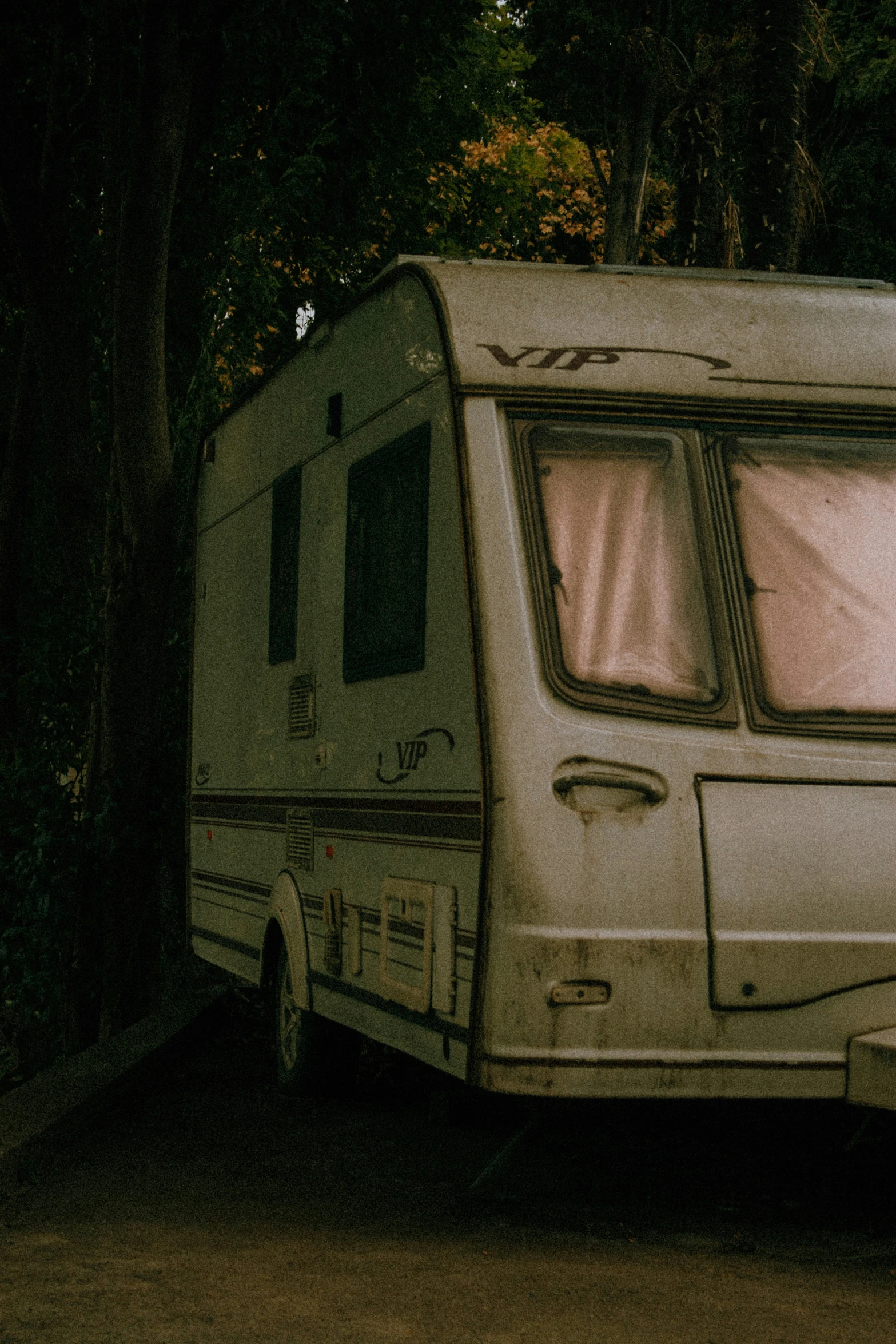 this is an old camper that has been parked on the side of the road