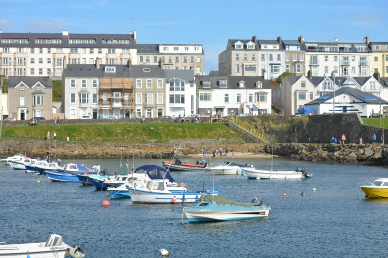 there are many small boats tied up in the water