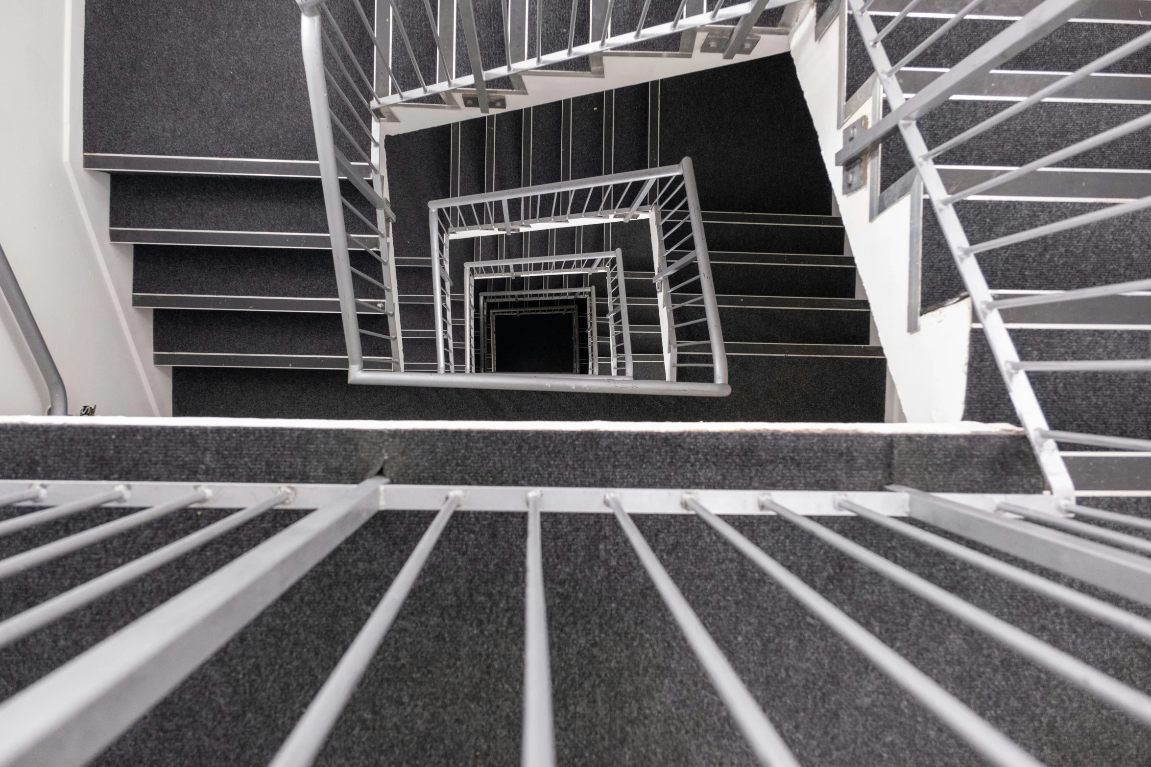 stairs and railings that are in an atrium