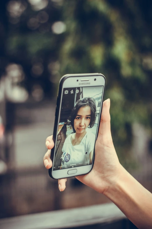 a woman is taking a picture on her phone