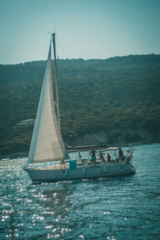 a boat floating in the middle of the ocean