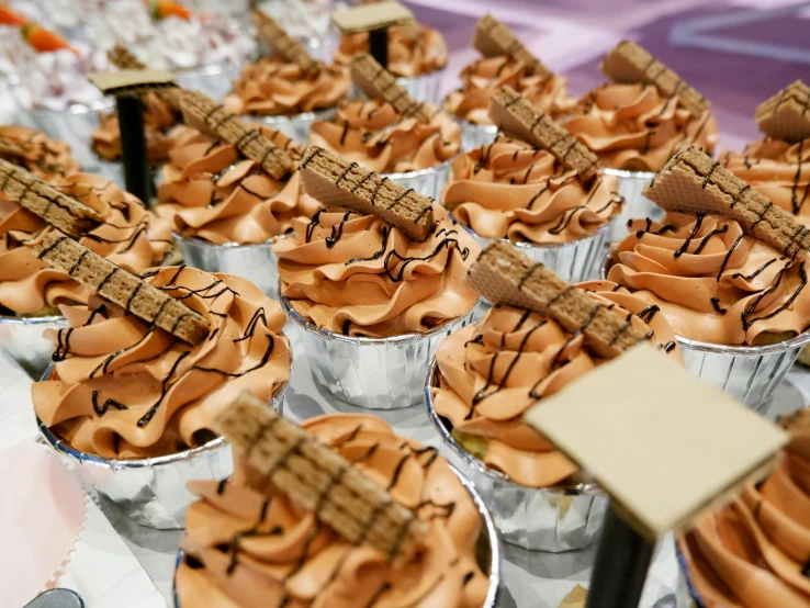 a variety of cupcakes that are on display