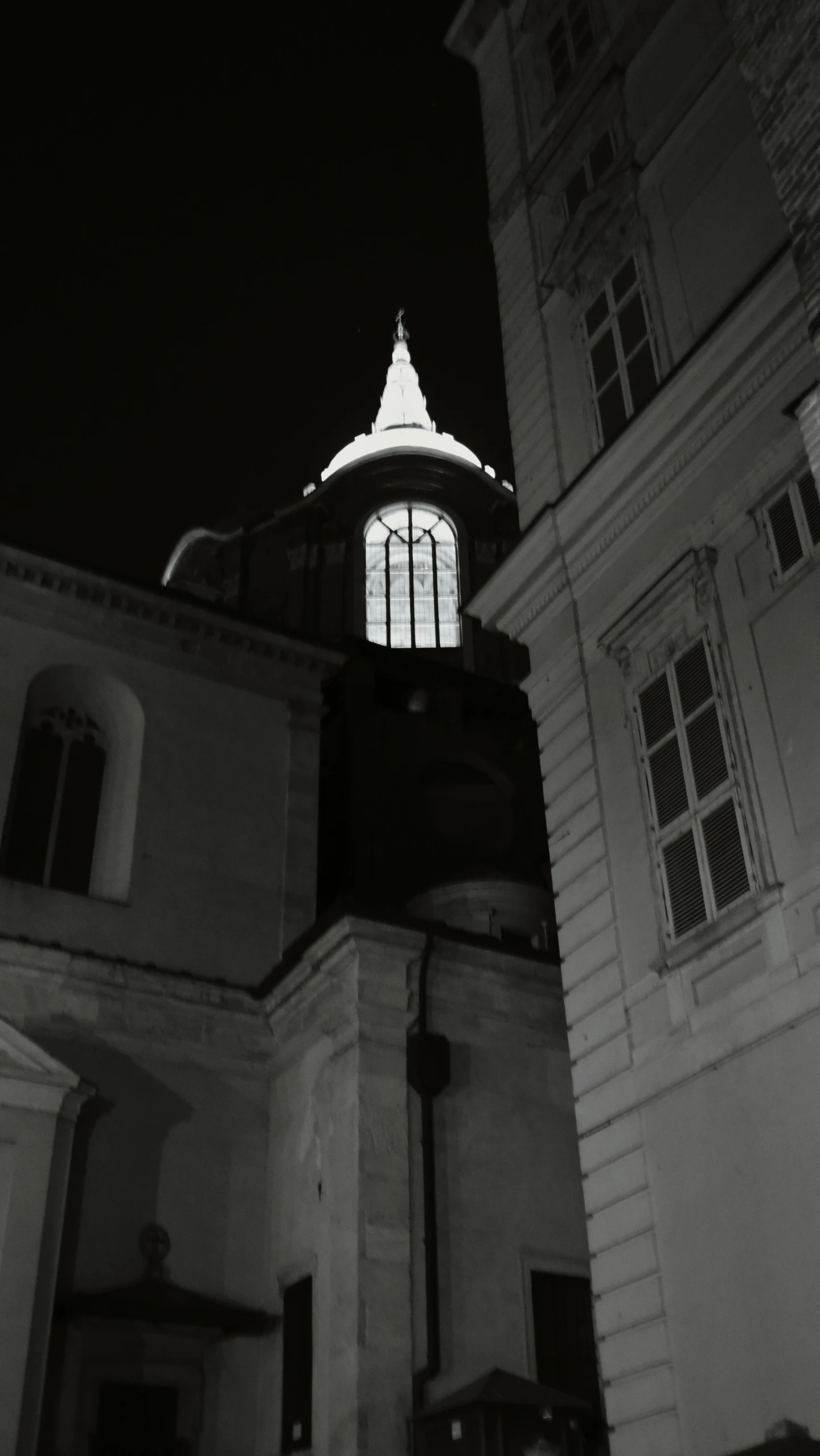 black and white po of a clock tower at night