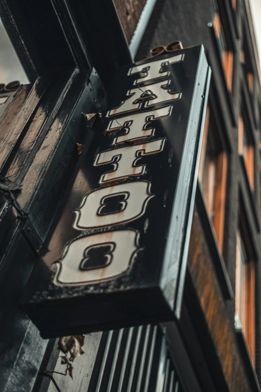 the side of a building with a close up of an old clock