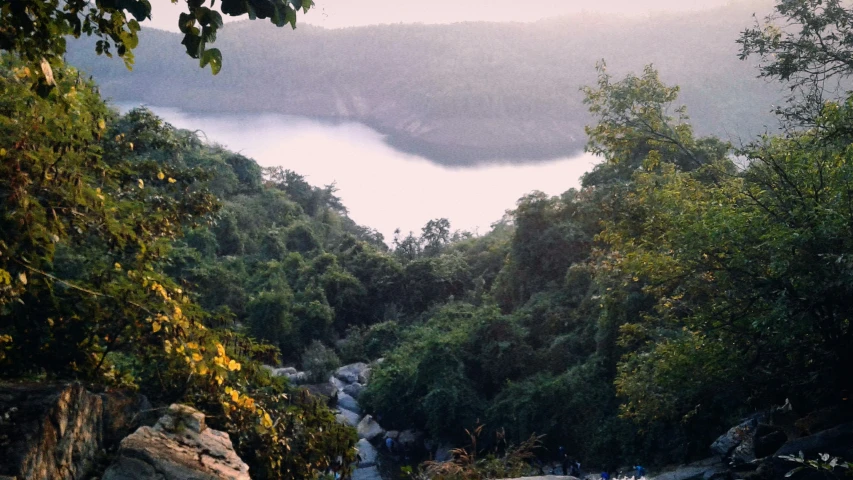 an image of people walking around on a hillside