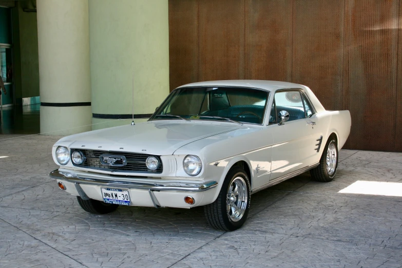 this old mustang is being parked outside a building