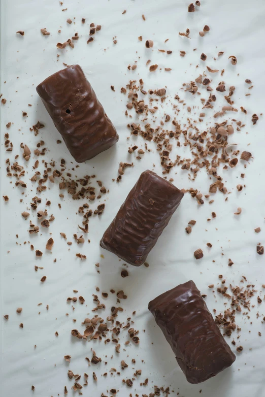 three pieces of chocolate are laying on a paper towel