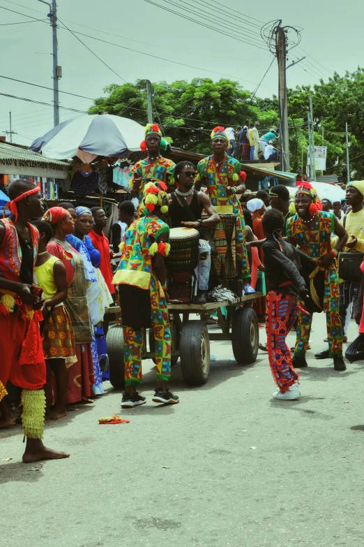 people standing on the street near vehicles and a crowd