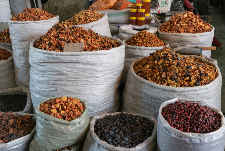 many bags filled with different types of fruit