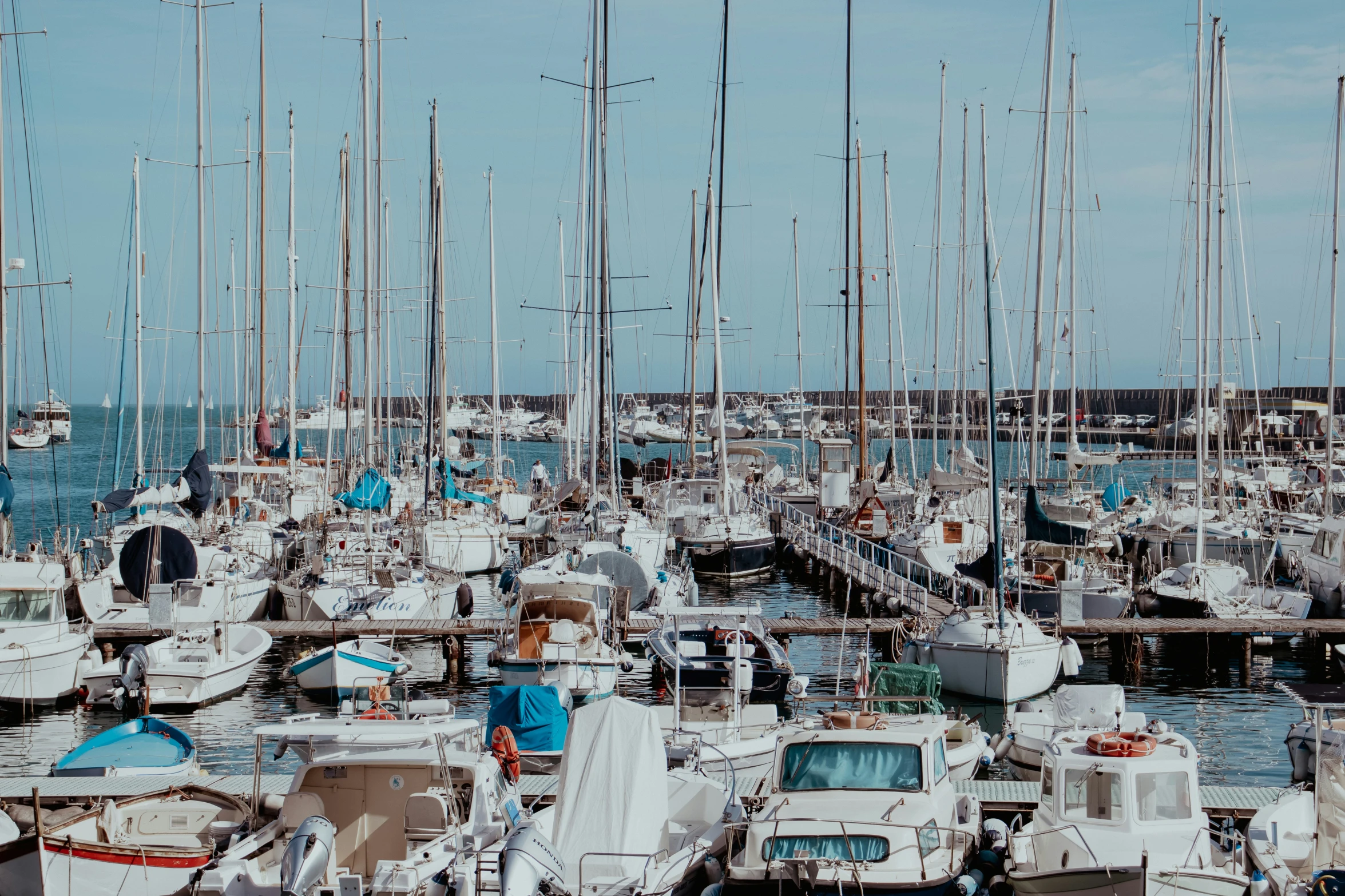 a large group of boats that are all in the water