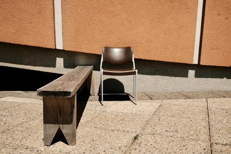 a chair and a table on a sidewalk