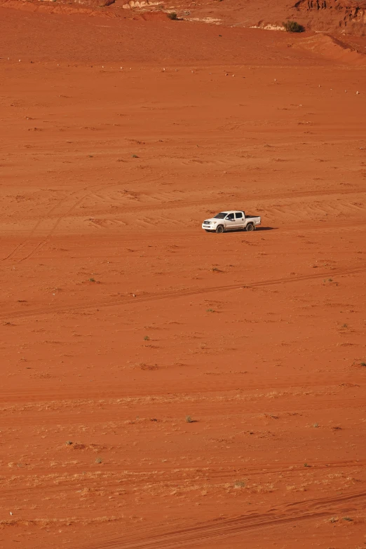 a truck sits in a field with its hood up