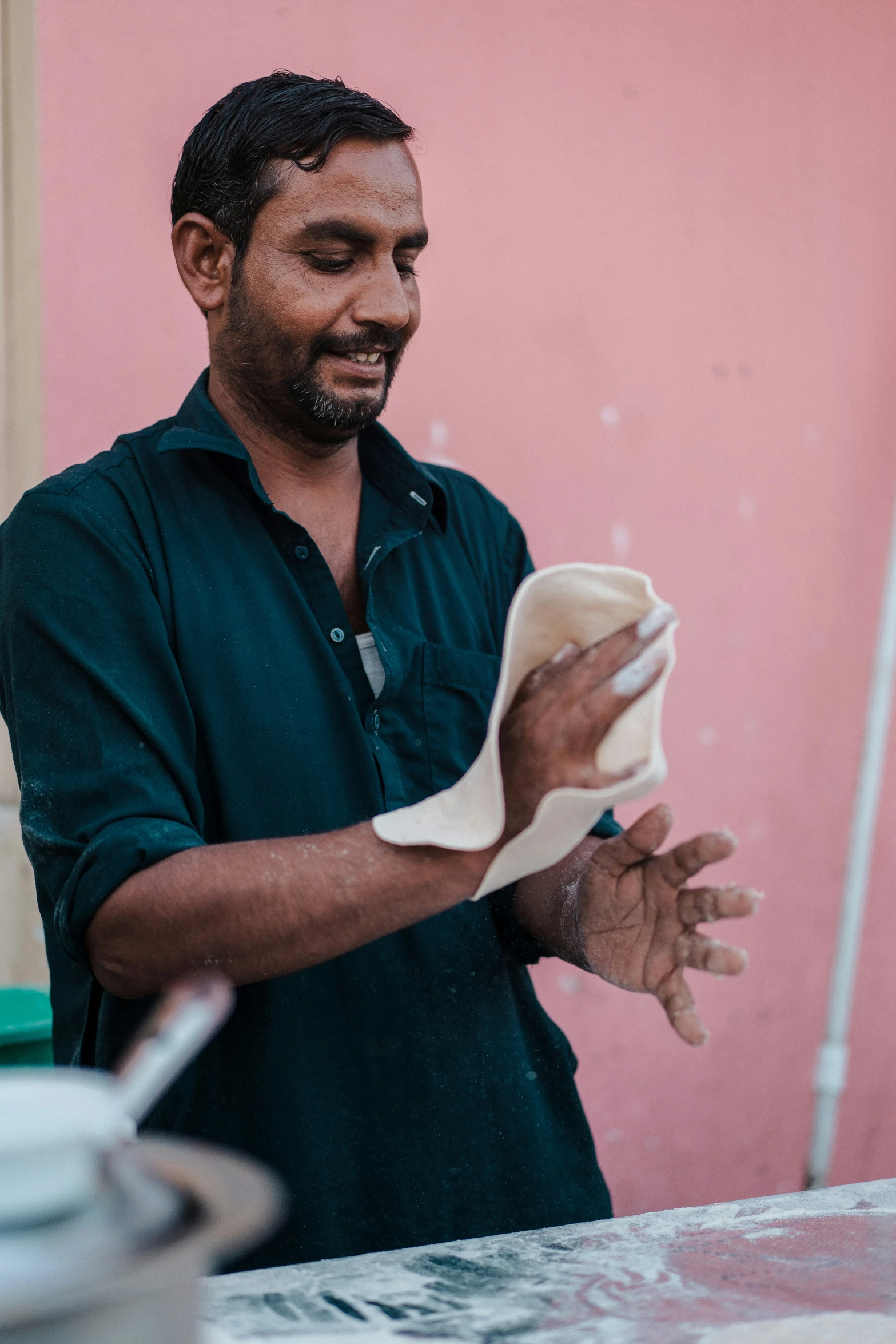 a man wiping up soing with his left hand