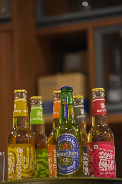 several different types of beer are in bottles