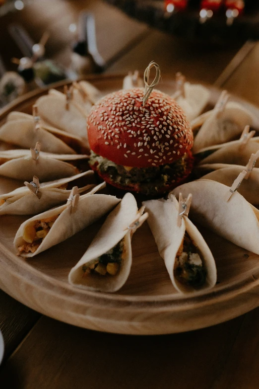 food and vegetables on plates that are displayed on the table