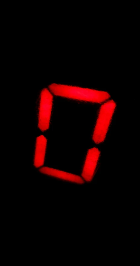 the red letter e is placed on a dark background