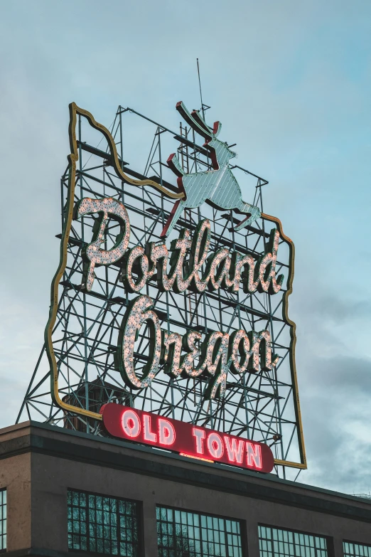 the old town sign on top of the building