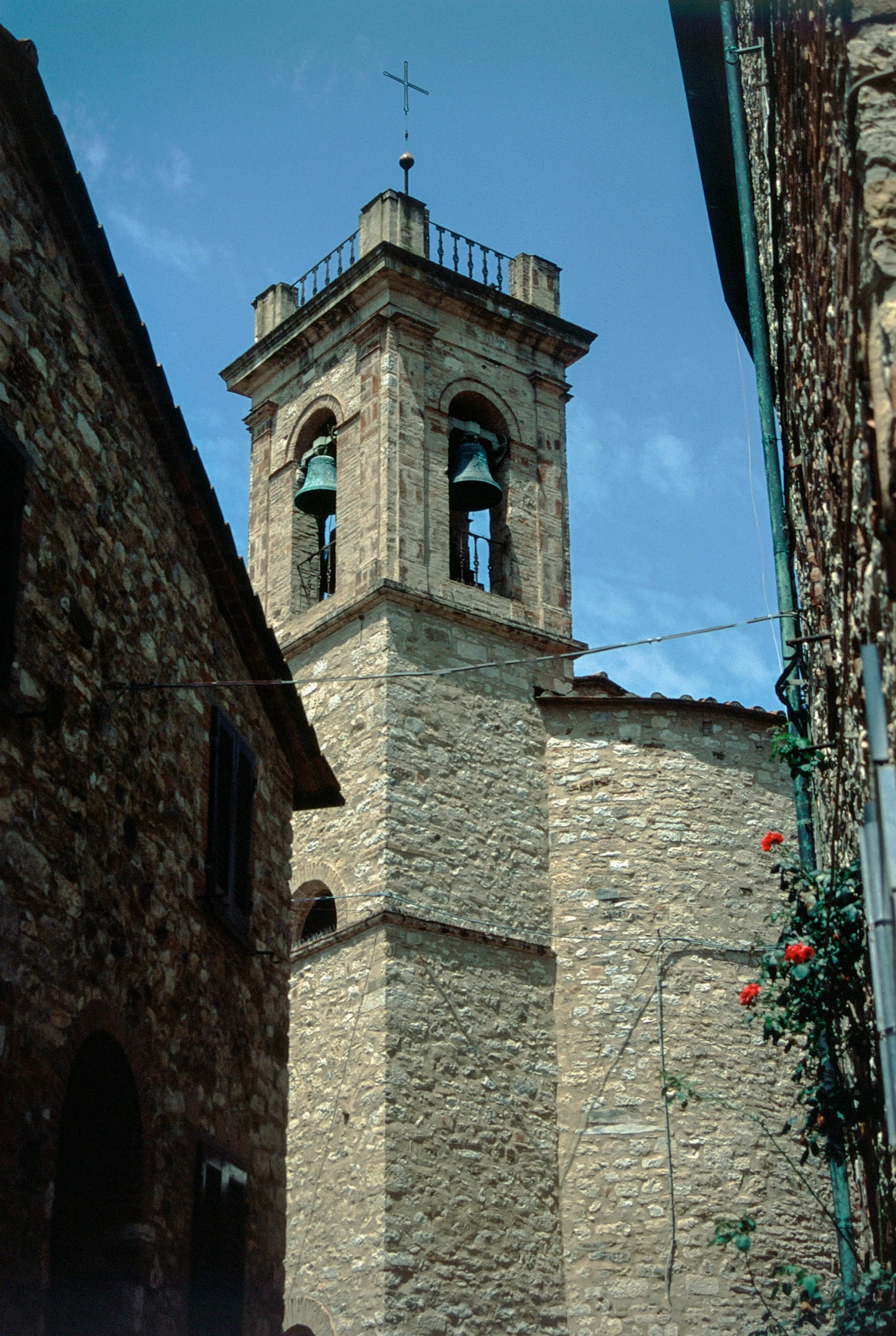 a brick and stone tower with a clock