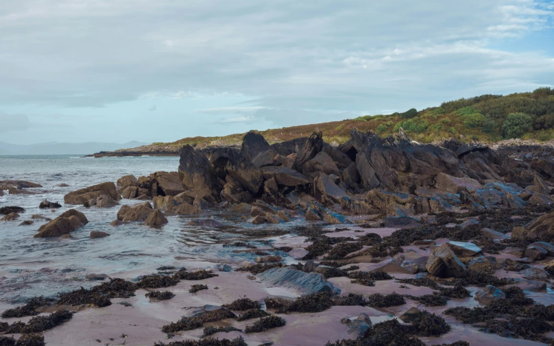 rocky coastline with a lone boat off in the distance