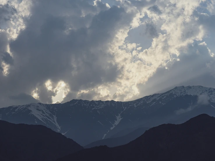 the mountains are covered in some white snow