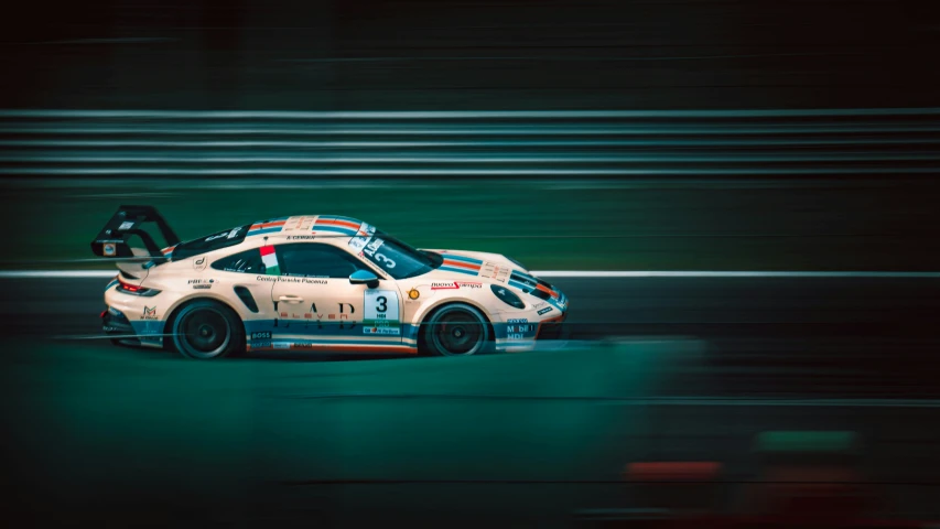 an extremely modified car in motion on a race track