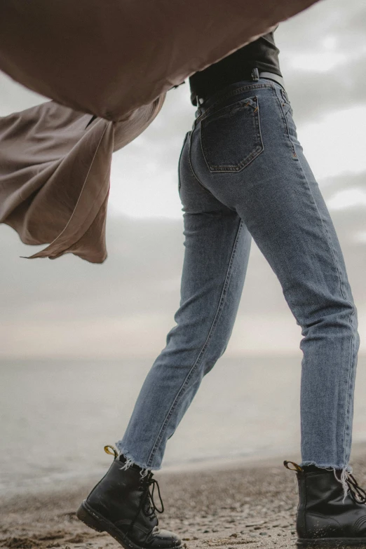 a person walks on top of the beach