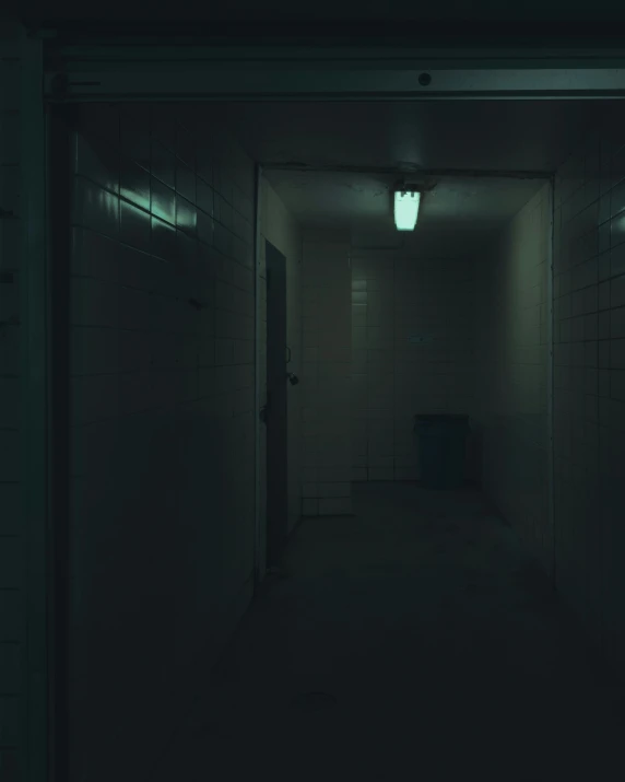 a dimly lit hallway with light on