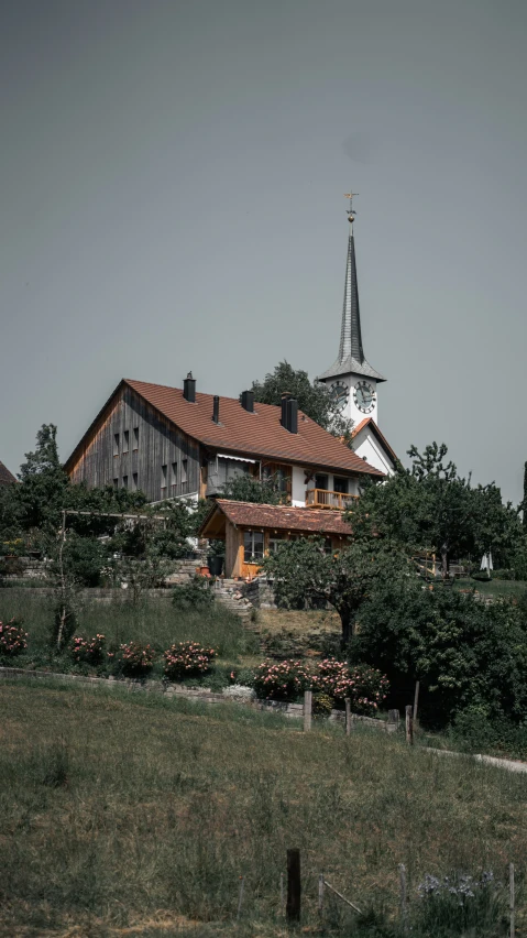 a brown and white building in the countryside