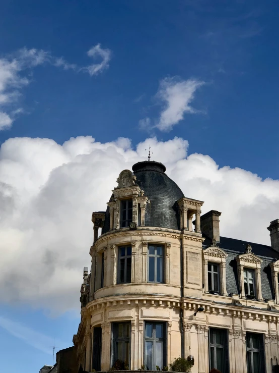 an image of a beautiful building under a cloudy sky