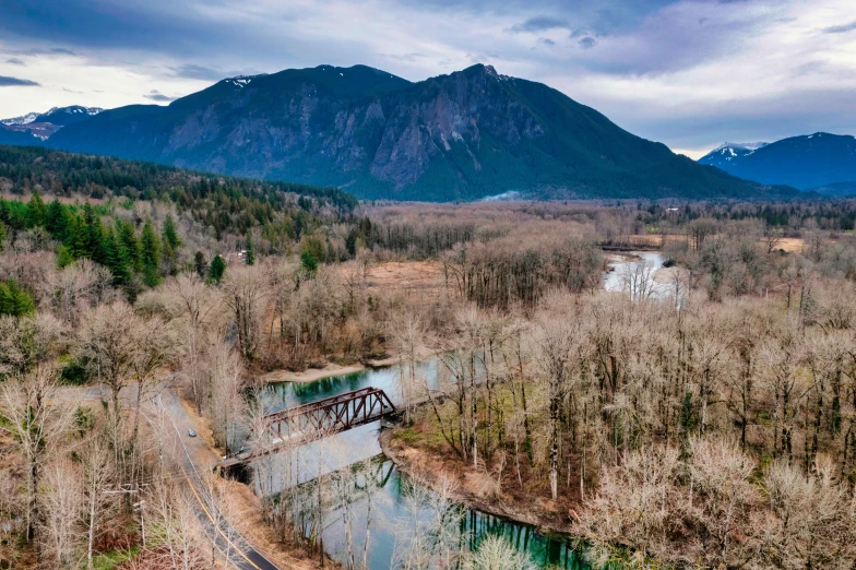 a mountain with mountains and a river in it