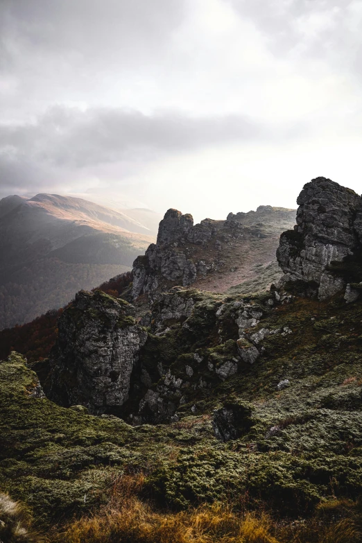 a tall mountain is covered in low cloud cover