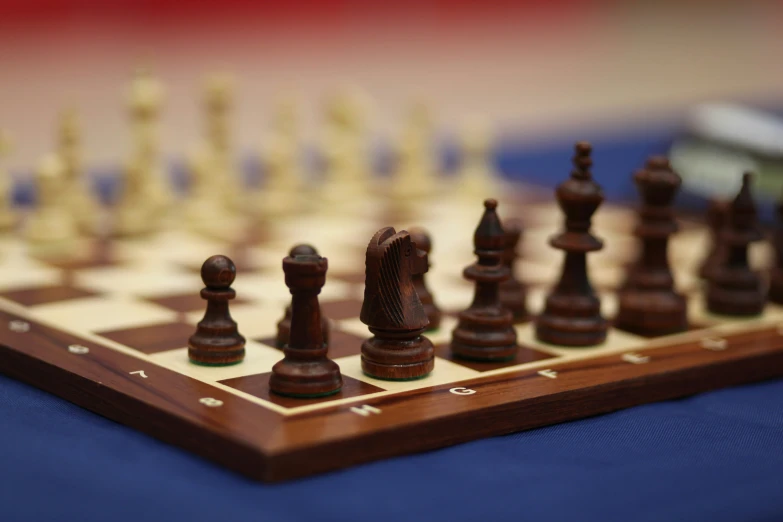 a large chess set is shown with pieces sitting on the board