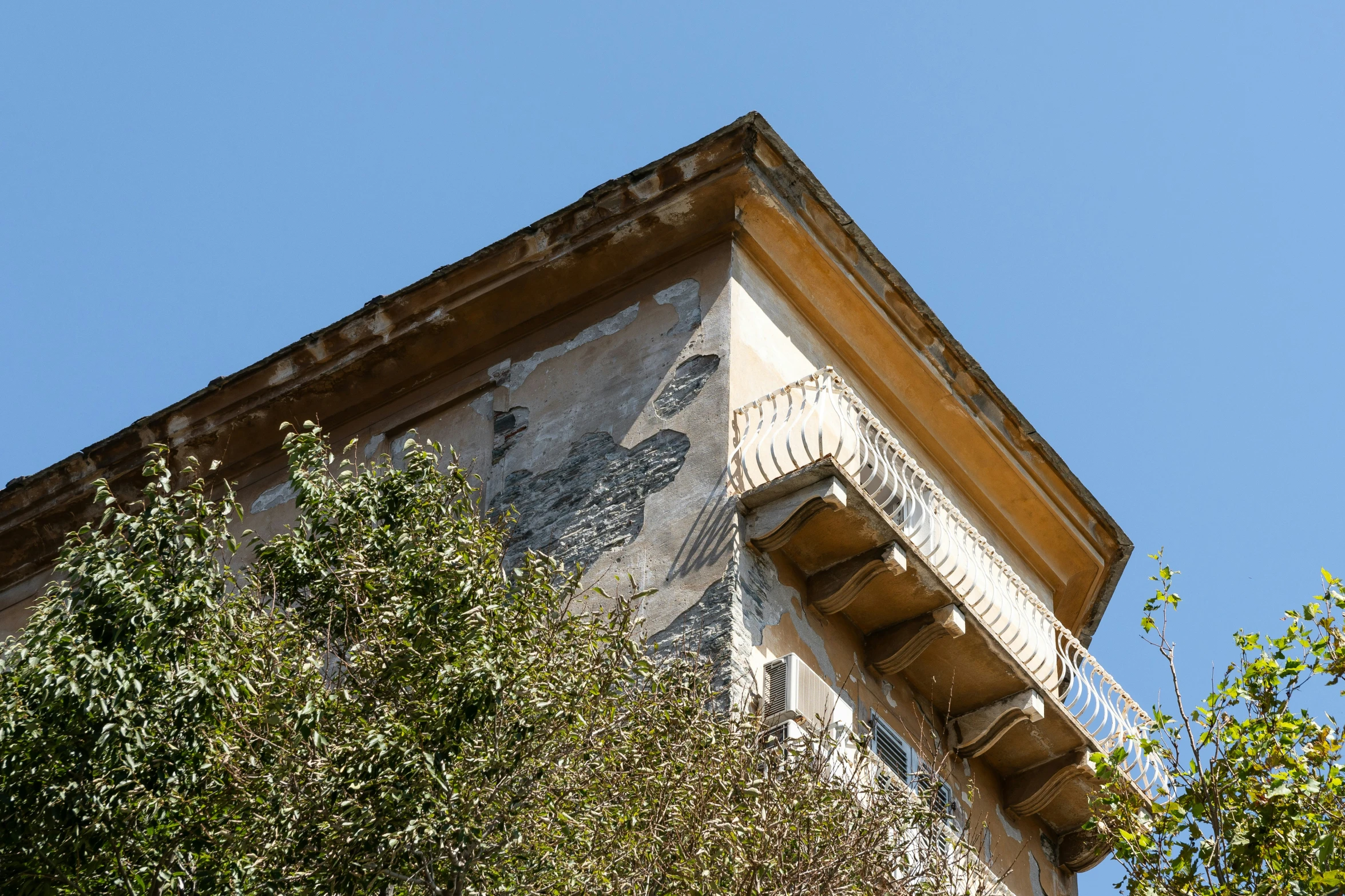 a picture of a building with trees around it