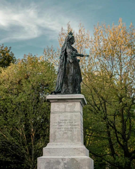 the statue is a woman with a gun