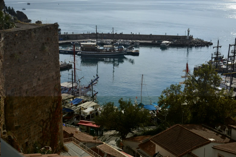 a harbor area with small boats and lots of houses