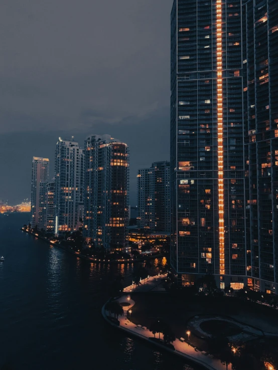 the skyline at night with skyscrs in the background