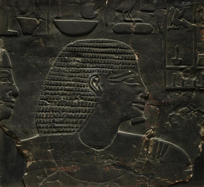 ancient egyptian stencular image of a woman wearing a headscarf