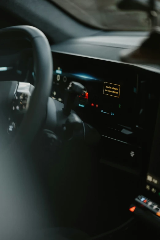 interior s of steering wheel and dashboard with an electronic screen