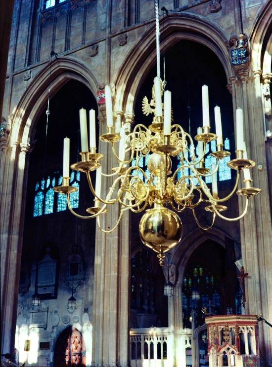 the large chandelier hangs from the tall ceiling in the cathedral