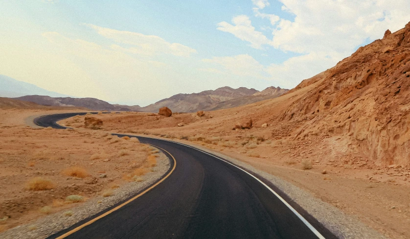 a view of a road in the middle of a mountainous landscape