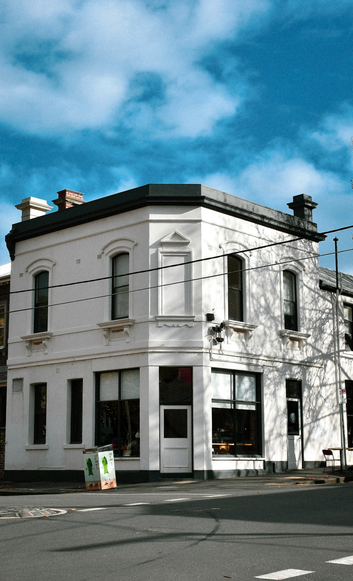 the old building is white with black windows