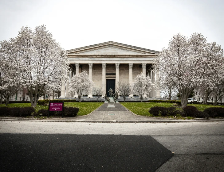 a view of a building with trees around it