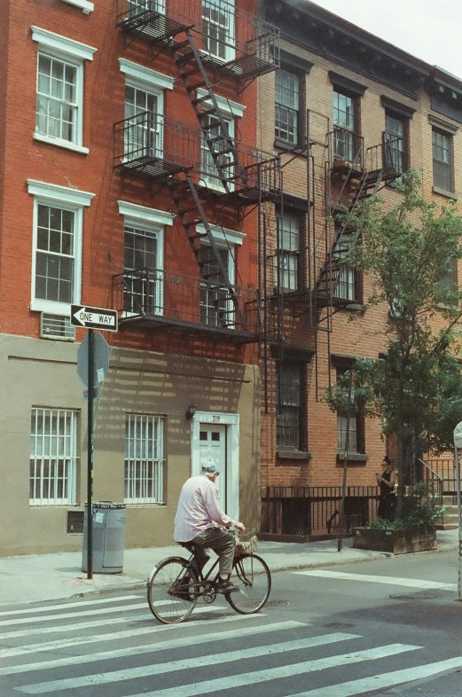 a person is riding his bike on the street