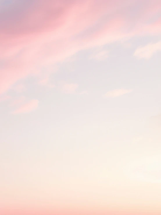 a pink and blue cloudy sky is pictured